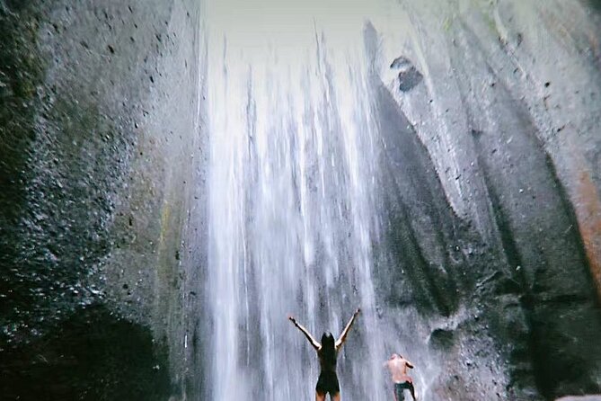 Bali Waterfalls Private Day Tour - Kanto Lampo: stepped rocks and green scenery for creative photos