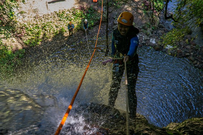 Beginner Canyoning trip in bali "Banyuwana canyon" - Training at the start point: lanyards, abseil, and hand signals