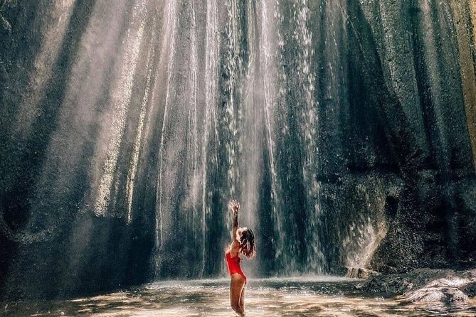 Discover the best waterfalls in Ubud and rice terraces tour - Kanto Lampo Waterfall: a standout shape and a river below