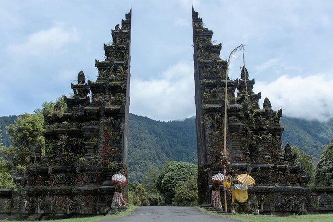 Full Day Bali North West Tour - Waterfall and Scenic Site - Stop 3: Handara Iconic Gate for carving details and that green-hill backdrop
